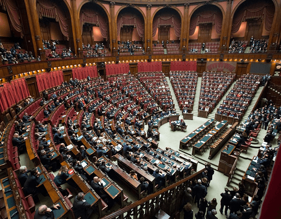 Legislative chamber with members seated in curved rows